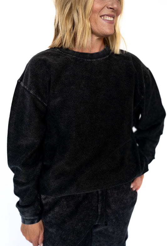 Comfy, oversized, and effortlessly cool—this washed corded crew is your new go-to for laid-back days with a little extra polish. Crafted from 100% cotton and custom dyed for that one-of-a-kind vintage look, this piece is soft, breathable, and stylish from couch to coffee run.

✨ Each crew is uniquely snow-washed for a rich, lived-in vibe that only gets better with time.

Details:

100% Cotton

Vintage-dyed &amp; snow-washed for ultimate softness

Ribbed crew neckline, cuffs, and hem for a clean finish

