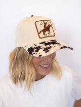 Cream hat with brown cowboy roper patch
Cow print bill for a fun western vibe 🐄
Adjustable back for the perfect fit
Lightweight + comfortable for all-day wear