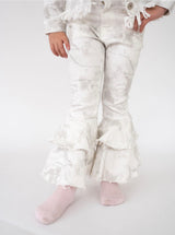 A child wearing white woodland camouflage  ruffled flare pant on a white background