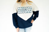 Cougars chenille varsity colorblock sweatshirt in heather gray and navy with oversized white COUGARS lettering outlined in navy and bright blue.