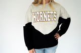 Hornets chenille varsity colorblock sweatshirt in heather gray and black with oversized white HORNETS lettering outlined in maroon and gold.