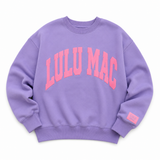 Lulu Mac lavender crewneck sweatshirt featuring oversized pink puff "LULU MAC" lettering across the front with a relaxed fit and ribbed cuffs, displayed on a white background.