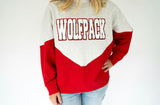 Wolfpack chenille varsity colorblock sweatshirt in heather gray and red with oversized white WOLFPACK lettering outlined in black and red.