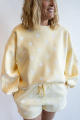 Yellow polka dot lounge set with oversized long sleeve sweatshirt and matching drawstring shorts