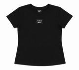 Lulu Mac youth black babydoll short sleeve tee with black and white logo patch on the chest, displayed as a flat lay on a white background.
