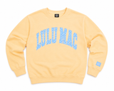 Lulu Mac youth butter yellow crewneck sweatshirt featuring a light blue polka dot collegiate-style Lulu Mac graphic, displayed as a flat lay on a white background.