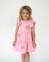 Girl in pink dress with sequins back to school decals on a white back ground