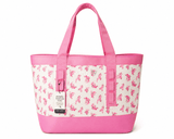 Pink tote bag with floral pattern on a white background and simply tough tote hanging tag